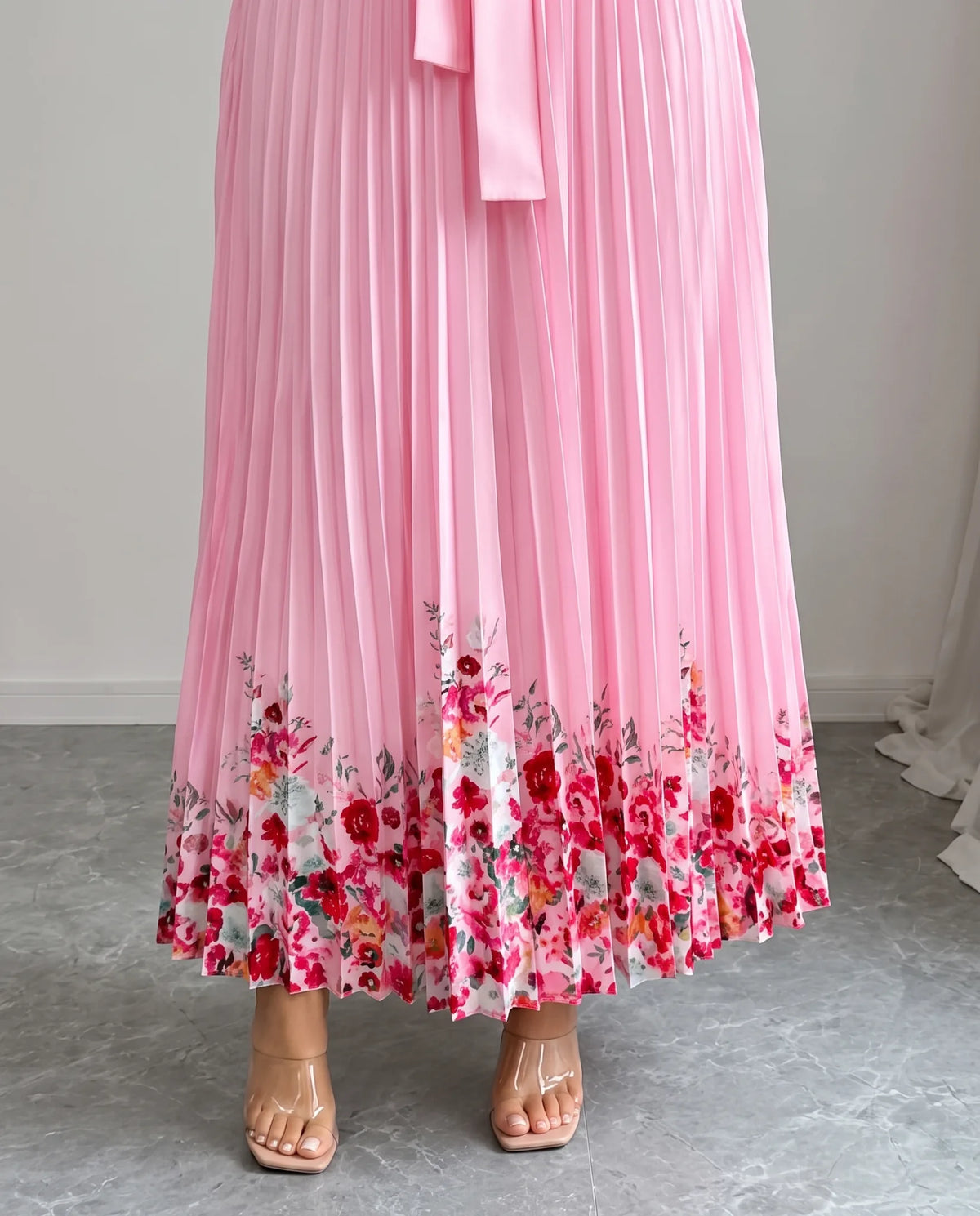 Charlie Floral Pleated Maxi Dress — pleated hem with floral border
